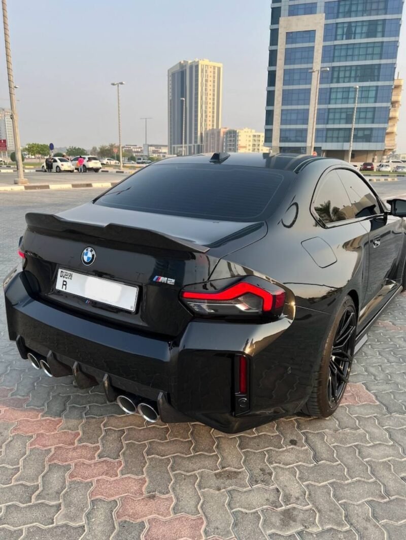 BMW M2 G87 rear view featuring dry carbon spoiler designed to enhance downforce and high-speed stability