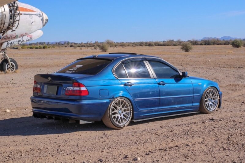 Aluminium rear bumper diffuser for BMW E46 displayed on white background, featuring multi-fin aerodynamic design